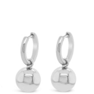 Pair of silver hoop earrings with round ball charms on a white background