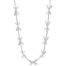 Silver necklace with interlocking design on a white background