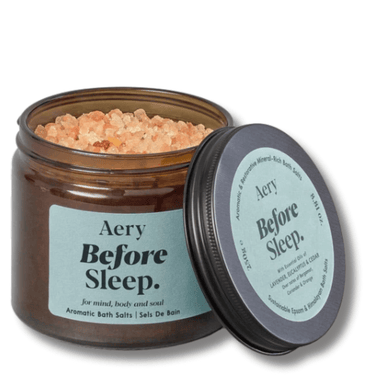 Aery Before Sleep bath salts jar with open lid on a white background