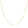 Gold necklace with small beads on a white background