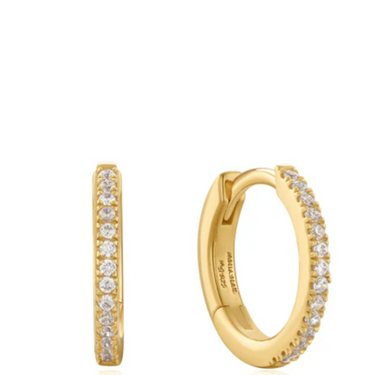 Gold hoop earrings with diamond accents on a white background