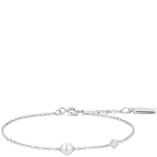 Silver bracelet with a pearl on a white background