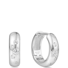 Silver hoop earrings with embedded diamonds on a white background