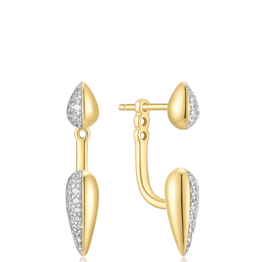 Gold and silver earrings on a white background
