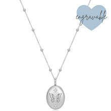 Silver necklace with a butterfly pendant on a white background