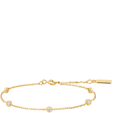 Gold bracelet with small diamonds on a white background