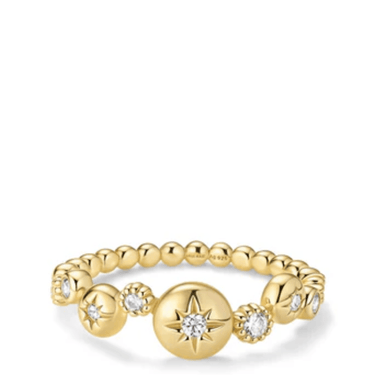 Gold ring with star and diamond design on a white background