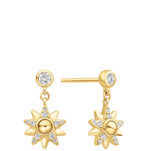 Gold sun-shaped earrings with small diamonds on a white background