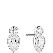A pair of silver stud earrings featuring a large pear-cut clear gemstone with a smaller round clear gemstone above it, shown on a plain white background.
