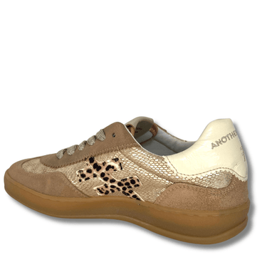 Beige sneaker with leopard print details on a white background
