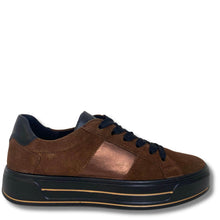 A low-top platform sneaker in brown suede with a metallic bronze panel on the side, navy blue laces and collar, and a thick black platform sole with a thin gold accent line.