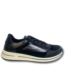 A black leather sneaker with a textured metallic iridescent side panel, black laces, and a thick cream-colored sole, shown from a side profile on a white background.