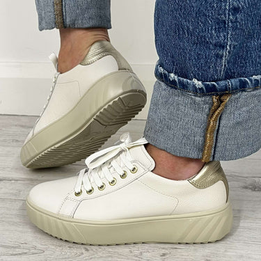 ladies off white sneakers with gold held tab