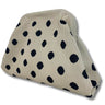 Beige cushion with black polka dots on a white background