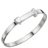 Silver bracelet with a heart charm on a white background