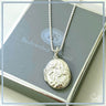 Silver necklace with an engraved pendant on a gray box with 'BeJeweled by Soul' branding.