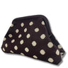 Black cosmetic bag with white polka dots on a white background