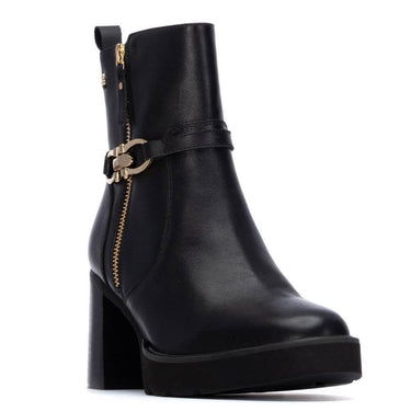 Black ankle boot with gold zipper and buckle on a white background
