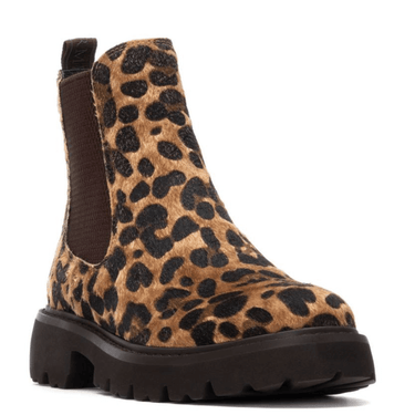 Leopard print boot with a brown sole on a white background
