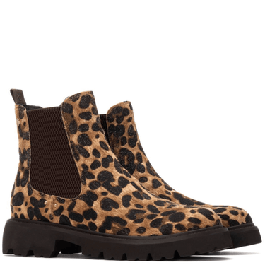 Leopard print boots with black soles on a white background