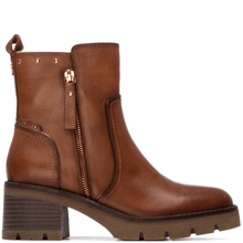 Brown leather boots with a zipper on a white background