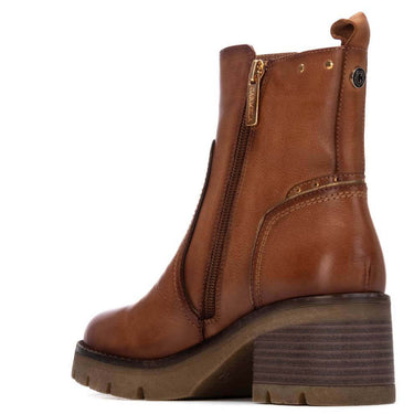 Brown leather boot with a block heel on a white background