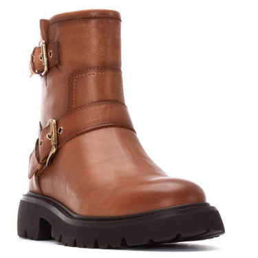 Brown leather boot with gold buckles on a white background