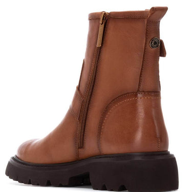 Brown leather boot with a zipper on a white background