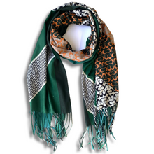 Multicolored scarf with patterns and fringes on a white background