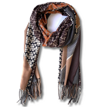 Multicolored scarf with patterns and fringes on a white background