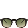 Sunglasses with tortoiseshell frame and green lenses on a white background