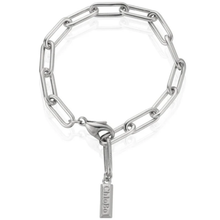 Silver chain bracelet with a tag on a white background