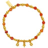 Gold beaded bracelet with orange beads and star charms on a white background