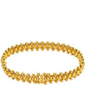 Gold beaded bracelet on a white background