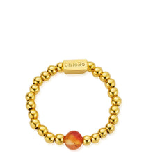 Gold beaded bracelet with a red bead on a white background, featuring the brand 'ChloBo'.