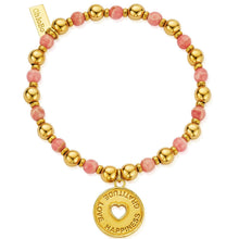 Gold and pink beaded bracelet with a 'Gratitude Love Happiness' charm on a white background