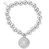 Silver beaded bracelet with a round, textured charm on a white background
