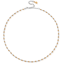 Necklace with gold and silver beads on a white background