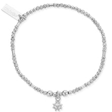 Silver bracelet with star charm on a white background
