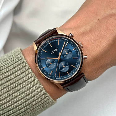 cluse-antheor-multifunction-brown-leather-watch-blue-on-mans-arm
