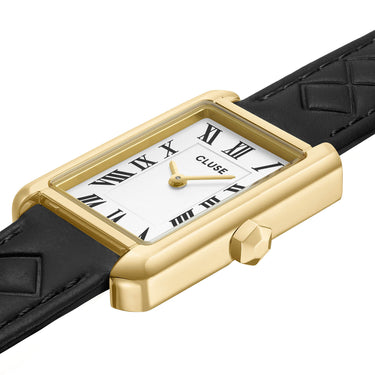Gold-framed watch with black strap on a white background