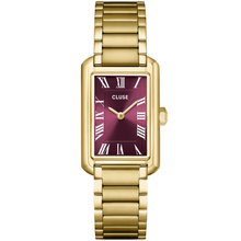 Gold watch with a maroon face on a white background