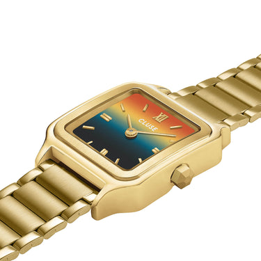 Gold watch with a colorful face on a white background