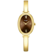 A gold-tone oval watch with a brown dial and Roman numeral hour markers, shown on a light gray background. The brand name 'CLUSE' is printed on the dial.