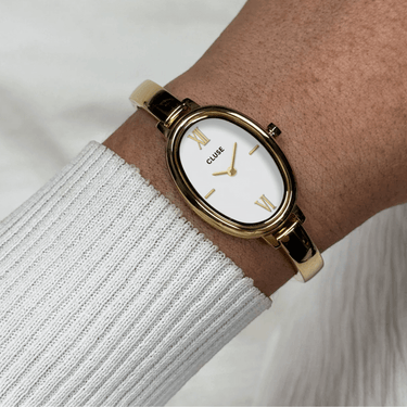 ladies-gold-oval -watch-with simple fine-metal-strap