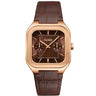 A Cluse watch with a rose gold-toned square case, a dark brown dial with two subdials, and a dark brown leather strap, shown against a plain white background.