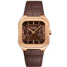 A Cluse watch with a rose gold-toned square case, a dark brown dial with two subdials, and a dark brown leather strap, shown against a plain white background.