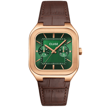 Cluse watch with green face and brown leather strap on a white background