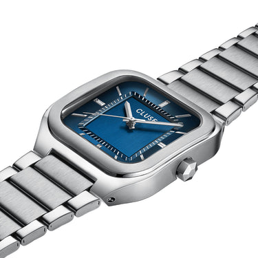 Silver watch with blue face on a white background
