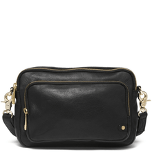 Black leather crossbody bag with gold accents on a white background